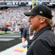 Jon Gruden of the Las Vegas Raiders walks on the field before a game against the Chicago Bears at Allegiant Stadium on October 10, 2021 in Las Vegas, Nevada.